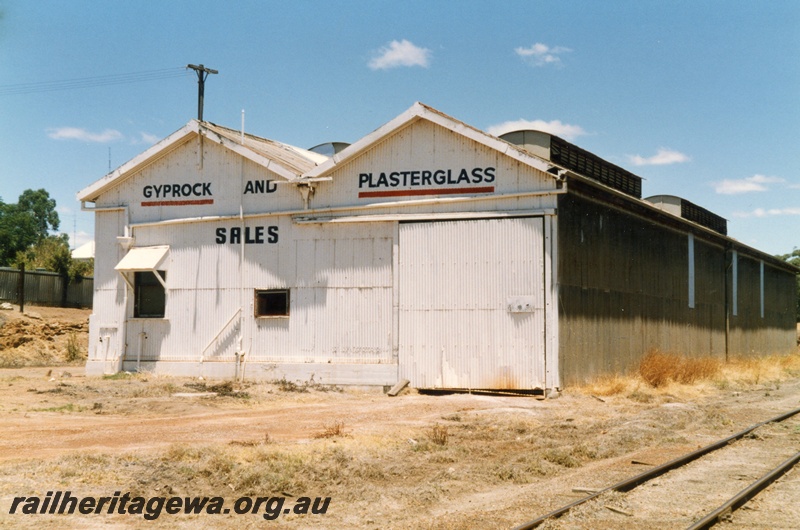 P15160
2 of 2 views of the disused goods shed at Northam, ER line, with the tracks removed being use as a depot for 