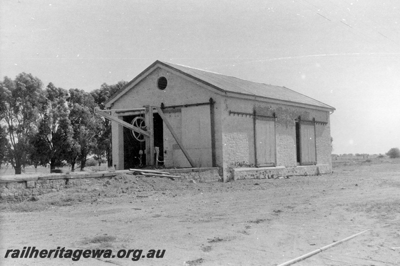 P15182
6 of 8 images of the railway precinct at Walkaway, W line, south end and streetside view of the goods shed with the platform crane on the loading platform attached to the shed. 
