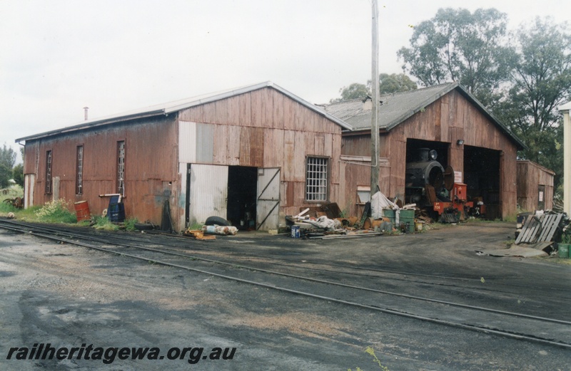 P15185
1 of 6 images of showing the Hotham Valley Railway's use of the facilities at Pinjarra, SWR line. PM class 706 protruding out of the loco shed, view from across the tracks
