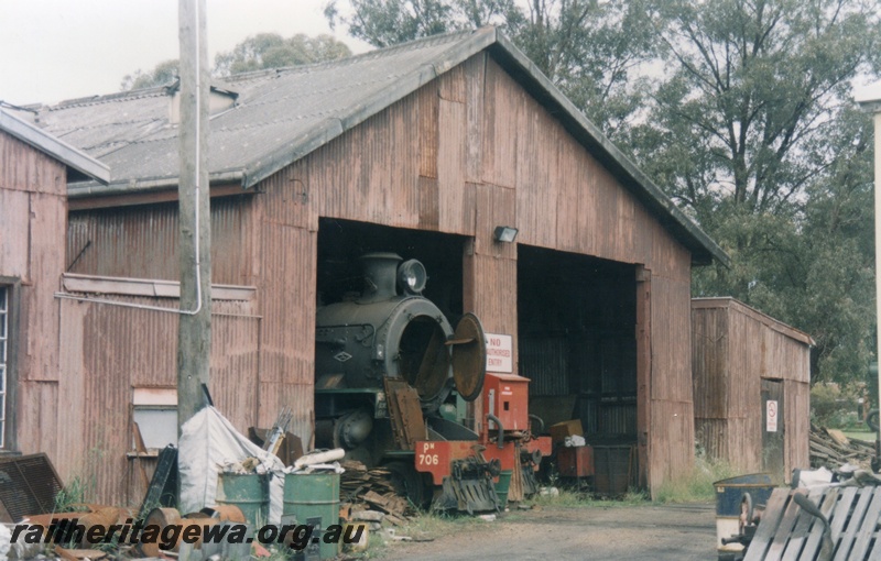 P15187
3 of 6 images of showing the Hotham Valley Railway's use of the facilities at Pinjarra, SWR line. PM class 706 with smoke box door open jutting out of the loco shed
