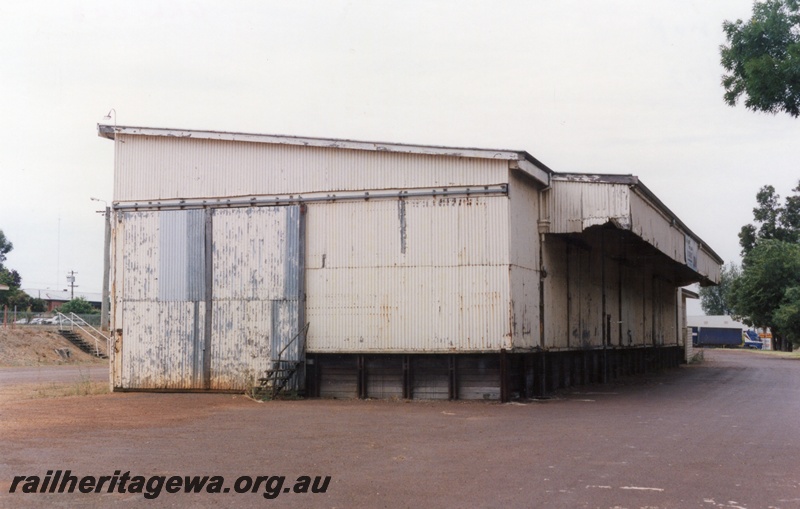 P15193
3 of 7 images of the railway precinct at Manjimup, PP line. Disused goods shed no longer served by rail. End and roadside view showing the canopy over the load out area.
