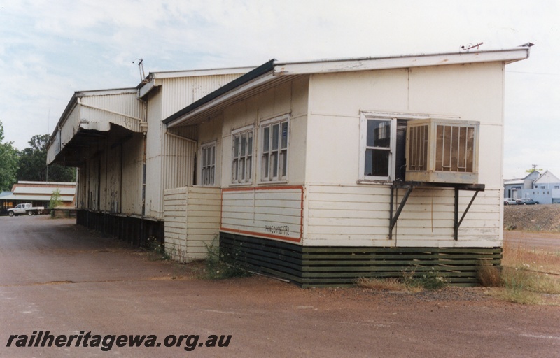 P15194
4 of 7 images of the railway precinct at Manjimup, PP line. Disused goods shed no longer served by rail, roadside and end view showing the canopy over the load out area.
