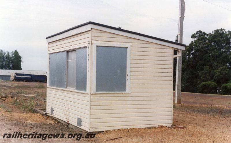 P15196
6 of 7 images of the railway precinct at Manjimup, PP line. Out of use weighbridge building, front and side view
