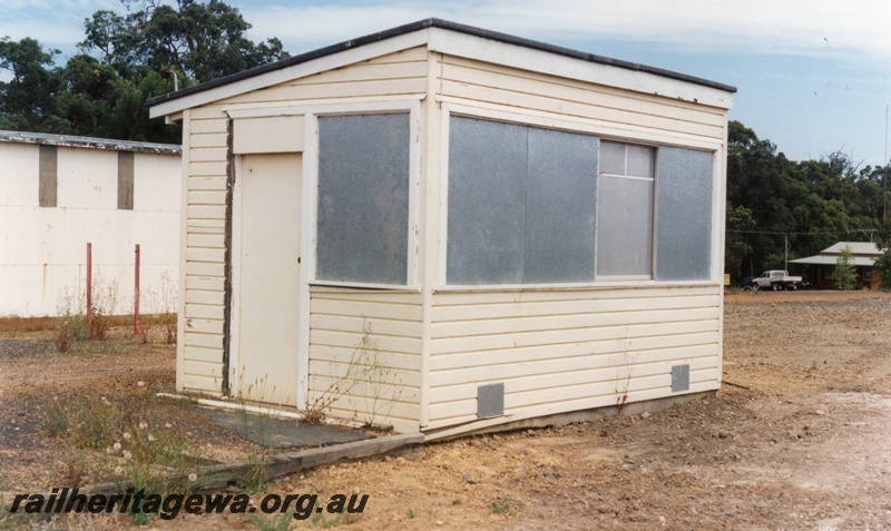 P15197
7 of 7 images of the railway precinct at Manjimup, PP line. Out of use weighbridge building, entry door end and front view
