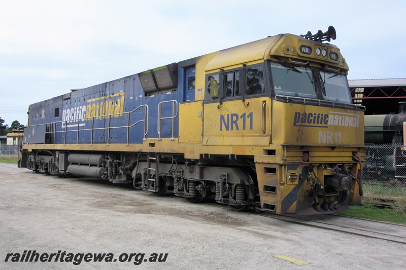 P15202
Pacific National NR class 11 traversing the line through the Rail Transport Museum en route to UGL's plant, side and front view
