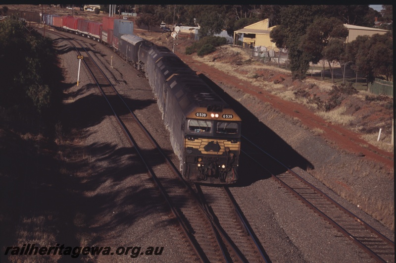 P15213
Freight Australia G class 539 approaching Kalgoorlie with a freight train, TAR line, elevated view along the train 
