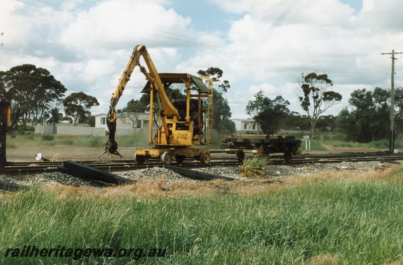 P15271
Mobile sleeper maintenance machine No 702, in operation, towing sleeper truck, Lake Grace, WLG line 
