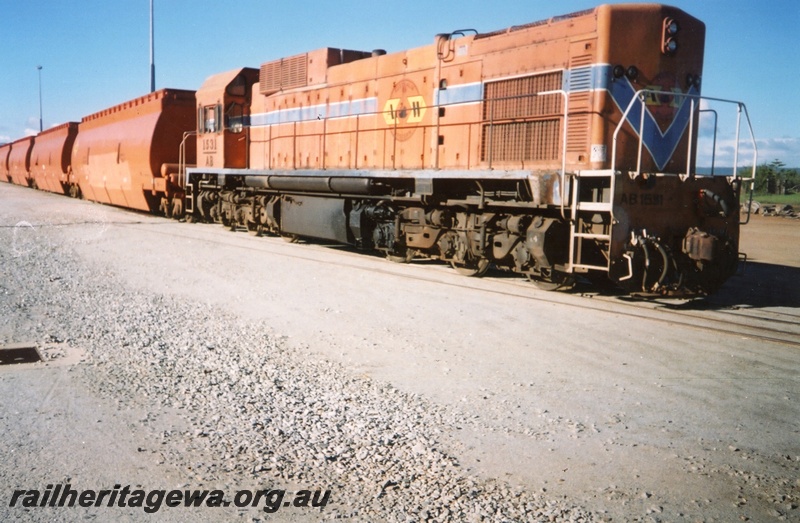 P15281
AB class 1531, in Westrail orange and blue colour scheme but with Australia Western Railroad initials and swan logo, on woodchip train, Albany, GSR line
