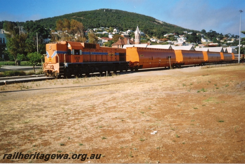 P15286
AB class 1536, in Westrail orange and blue colour scheme but with Australia Western Railroad initials and swan logo, on train of woodchip empties, Albany, GSR line
