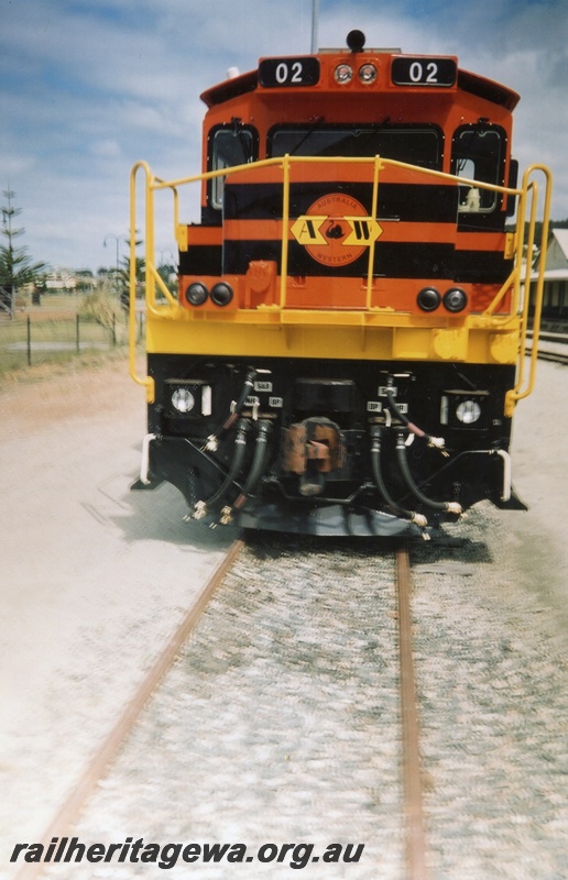 P15337
T class diesel locomotive 02 in the former yard at Albany. GSR line, Portion of Albany Station in background. Locomotive painted in Genesee & Wyoming colour scheme. Front view of loco.
