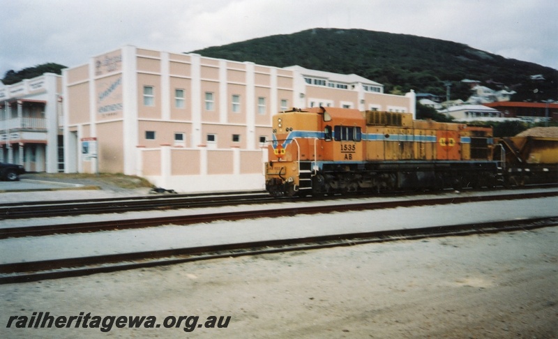 P15376
AB class 1535 diesel locomotive at the rear of a loaded woodchip train proceeding to the unloading point at Albany. GSR line.
