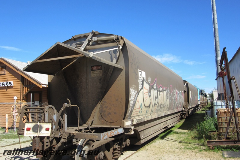 P15396
CBH Group CBHN class grain hoppers on the line through the Rail Transport Museum being hauled to UGL's plant, Bassendean, end and side view.
