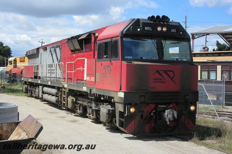 P15402
Mineral Resources loco MRL class 003, passing through the site of the Rail Transport Museum heading for UGL's plant, Bassendean, side and front view.
