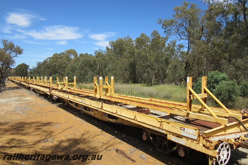 P15481
Rake of QUT class bogie flat wagons, converted from a QUA class to carry track, Coondle, CM line, view along the rake

