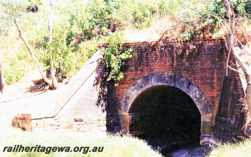 P15491
2 of 2 views of the south entrance to the culvert on the abandoned ER line at Werribee, the face and the wing walls of the culvert are of brick construction
