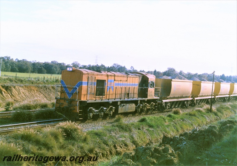 P15501
KA class 212 in the Westrail orange with blue stripe livery  heads a loaded Western Quarries 