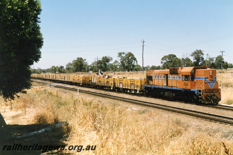 P15502
A class 1511 hauls its train through Hazelmere northwards towards Midland, view along the train
