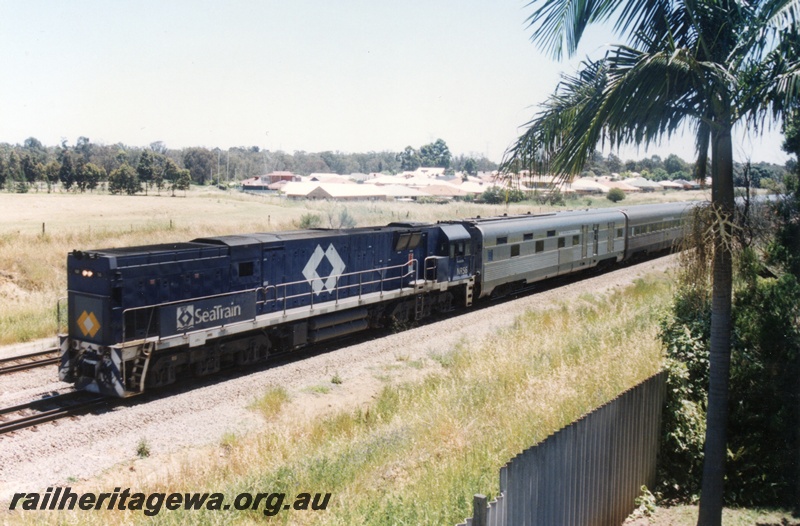 P15519
National Rail NR class 56 in the blue Seatrain livery, long hood leading, hauls the empty Indian Pacific train southwards through Hazelmere towards Forrestfield
