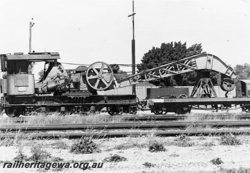 P15535
Cravens 25 ton breakdown crane No. 23 coupled to its match wagon, U class 1730-X, Midland, side view
