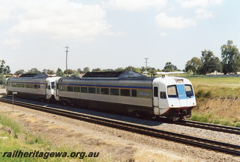 P15549
A two car prospector set travels northwards through Hazelmere heading for Perth Terminal.
