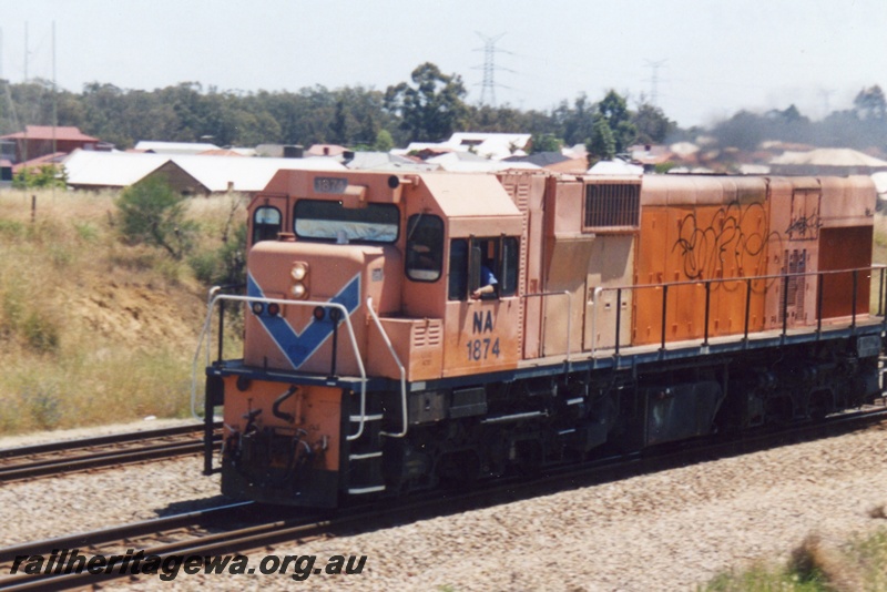 P15551
Unbranded NA class 1874 runs light engine southwards through Hazelmere towards Forrestfield
