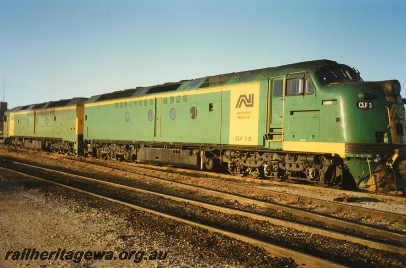 P15585
Australian National CLF class 30 in the green livery with yellow stripes on the nose and a yellow panel on the side, Forrestfield Yard, side and front view
