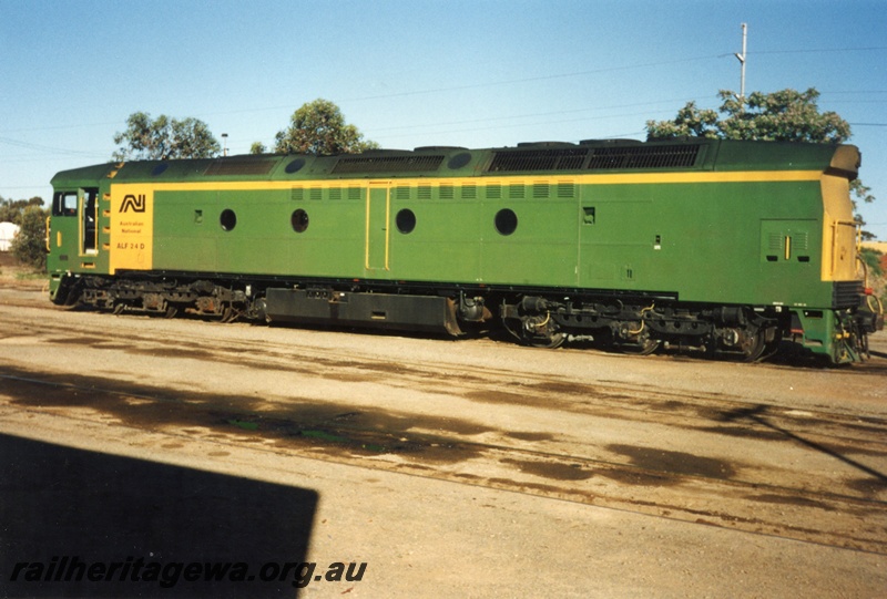 P15587
Australian National ALF class 24D in the green livery with a yellow end and a yellow panel and stripe on the side, Forrestfield Yard, side and end view
