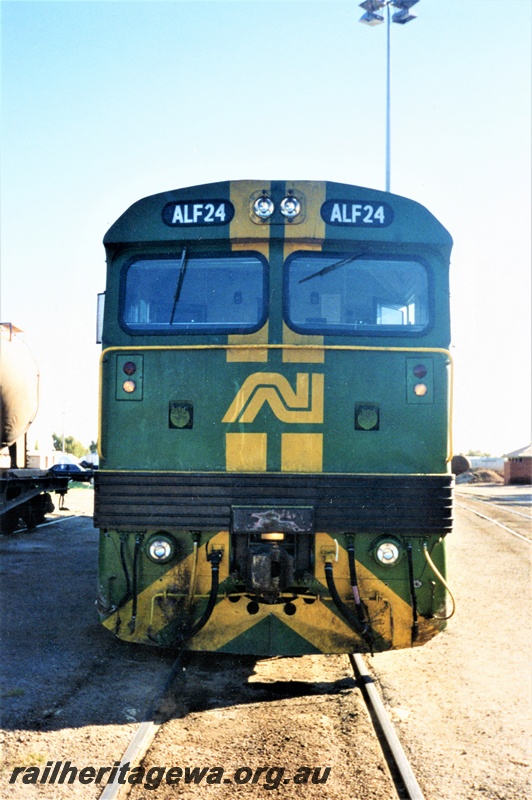 P15588
Australian National ALF class 24D in the green livery with yellow stripes on the nose, front view
