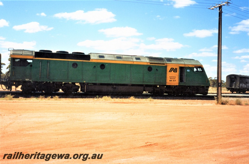 P15591
Australian National AN class 5F in the green livery with a yellow stripe and panel on the side, Forrestfield Yard, side view

