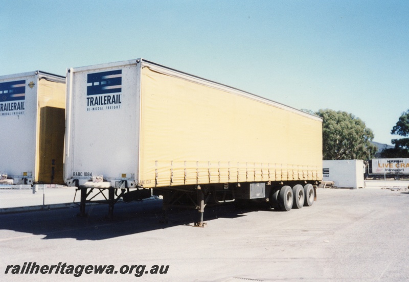 P15600
Trailerrail RANC class 1084, white end and yellow sides, Kewdale, front and side view
