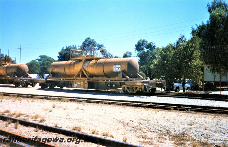 P15603
Australian Western Rail (AWR) WQH class 30026-F acid tank wagon, heavily weathered yellow livery, Kewdale, side and end view
