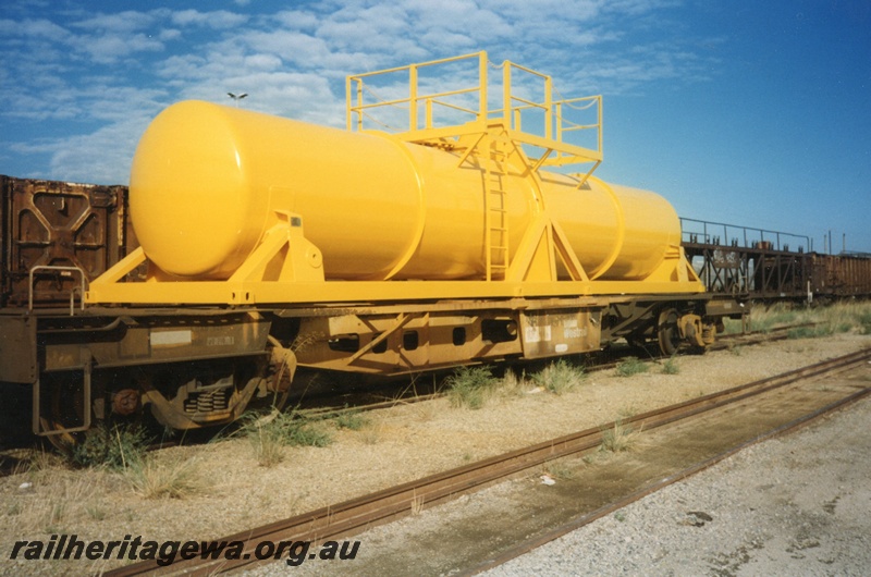 P15604
AWR WQH class acid tank wagon, yellow livery, tank newly painted, Kewdale, end and side view
