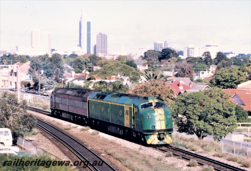 P15618
Australian National CL class 13 in the green livery with the yellow stripes on the nose an a yellow stripe and panel on the side coupled to a CL class in the marron and silver livery, Mount Lawley, side and front view.
