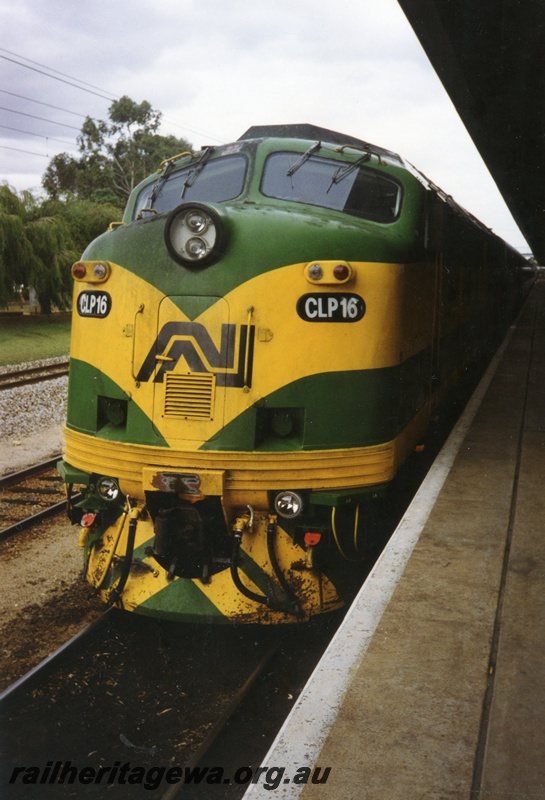 P15622
Australian National CLP class 16 in the green and yellow livery, East Perth terminal, running around its train, front view
