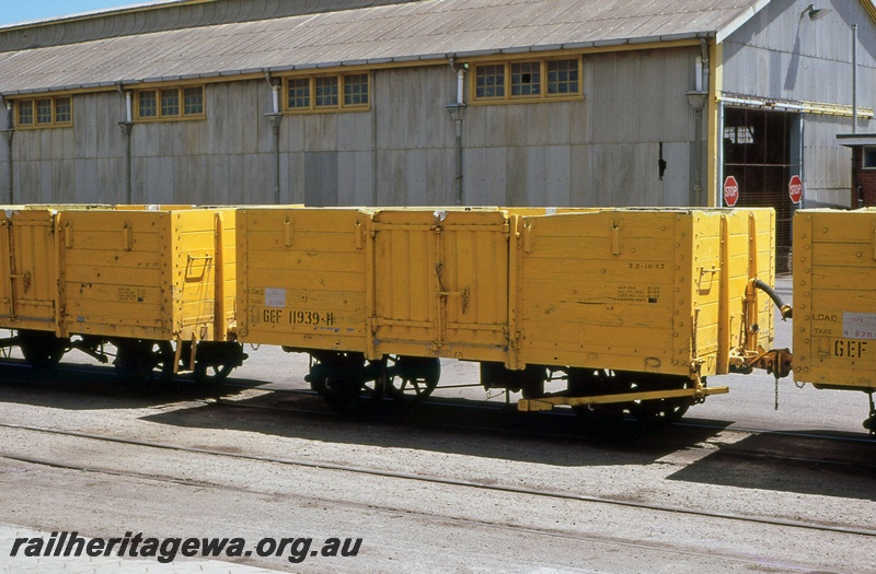 P15644
GEF class 11939 sandwiched between two other GEF class wagons, in the all over Westrail yellow livery, Geraldton yard, NR line, side and end view.
