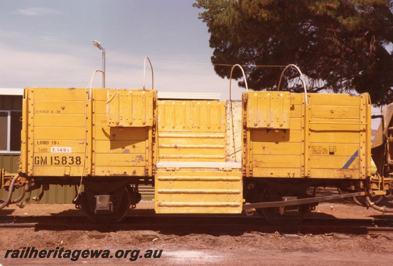 P15717
GM class 15838 four wheel medium sided wagon with cane hoops in place and the doors open, yellow livery, Corrigin, NWM line, brake lever side view
