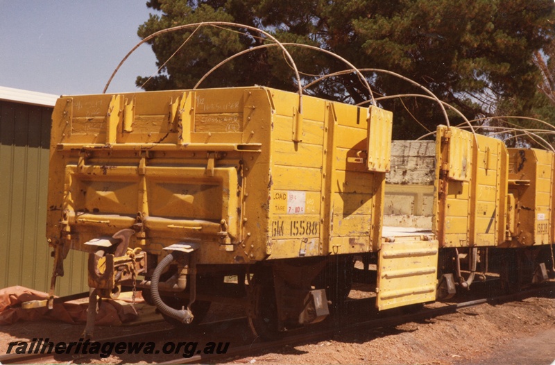 P15718
GM class 15588 four wheel medium sided wagon with cane hoops in place and the door down, yellow livery, Corrigin, NWM line, end and non brake lever side view
