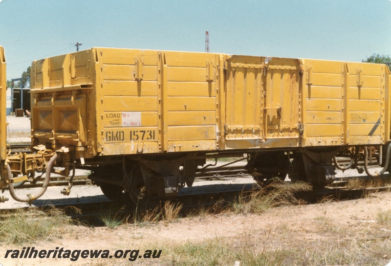 P15719
GMD class 15731 four wheel medium sided wagon, Yellow livery, Welshpool, end and non brake lever side view.
