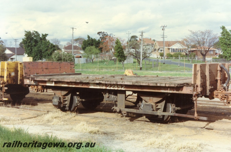 P15740
HD class 22892, four wheel flat wagon with end bulkheads, brown livery, brake lever side and end view.
