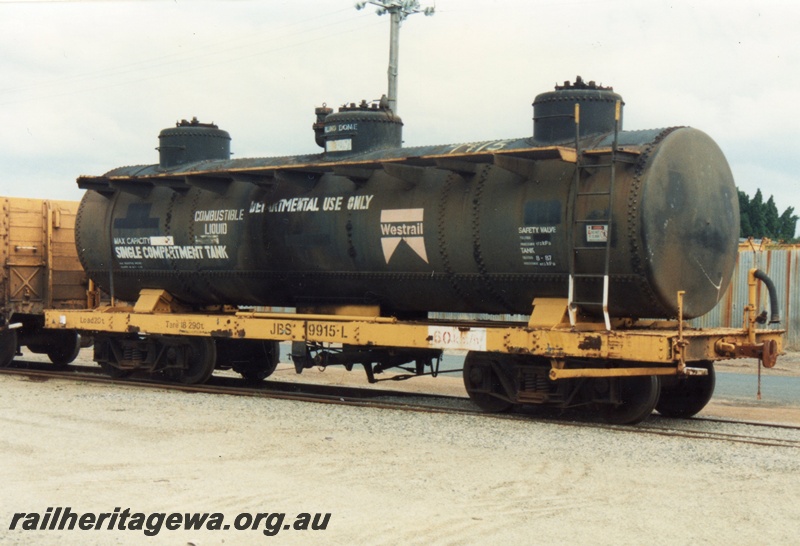 P15748
JBS class 9915-L bogie tank wagon, black three dome tank on a yellow underframe, Midland, side and end view
