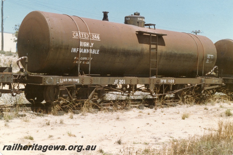 P15751
JF class 201 bogie tank wagon in Caltex ownership, overall black livery, Welshpool, end and side view
