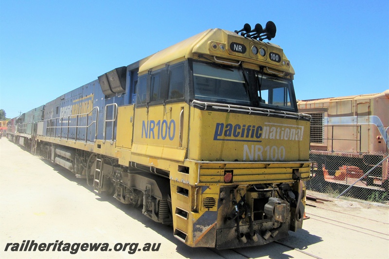 P15756
Pacific National NR class 100 passing through the site of the Rail Transport Museum heading for UGL's site, Bassendean, side and front view.
