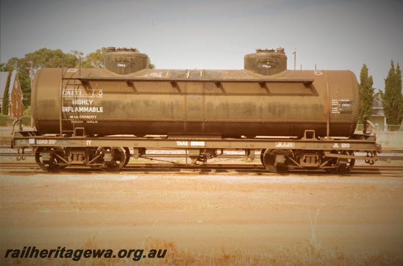 P15770
JL class 120 bogie tank wagon, in Caltex ownership, black livery, Brookton, GSR line, side view
