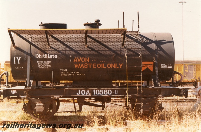 P15772
JOA class 10560-Q four wheel tank wagon, black livery with an orange Westrail motif on the side, 