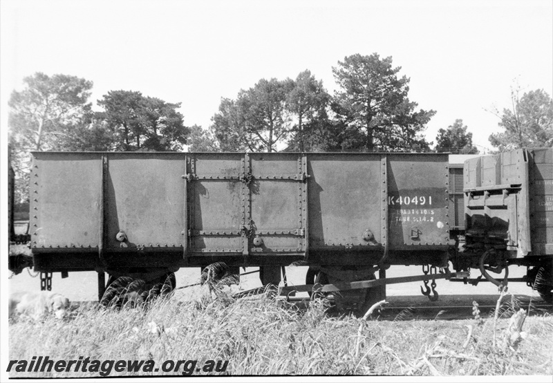 P15785
K class 40491, ex MRWA PA class all steel four wheel open wagon, brown livery, Subiaco, brake lever side view, c1960s.
