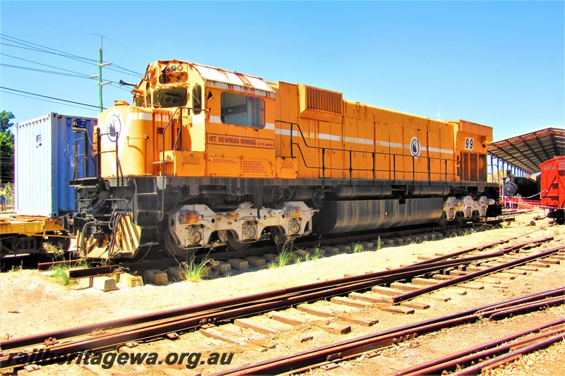 P15788
Mount Newman Mining Alco loco M636 class 5499 on display at the Rail Transport Museum, orange livery with a white horizontal stripe and a MT Newman Mining motif on the nose and the side, Bassendean, front and side view.
