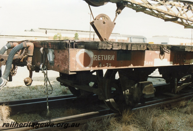 P15797
1 of 5 views of NFA class 22849 four wheel flat wagon being used as a match truck for a steam crane at Midland, brown livery but with a yellow brake lever. End and side view of the headstock and the side sill
