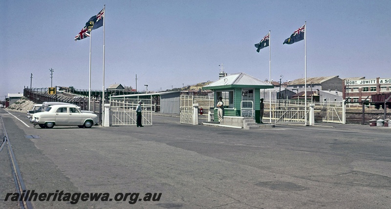 P15845
Partial view of a M class coal box wagon in the background of a view of 