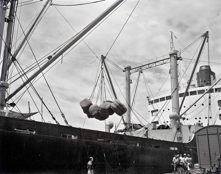 P15852
Loading wool onto a ship from a FD class van at No. * berth, Fremantle Harbour
