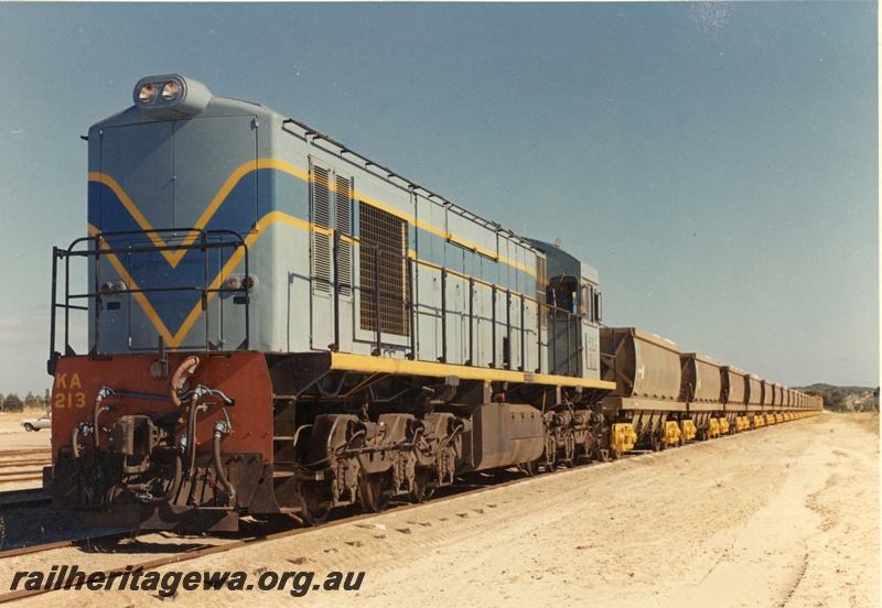 P15876
KA class 213, in light blue with dark blue and yellow stripe livery, on freight train, front and side view
